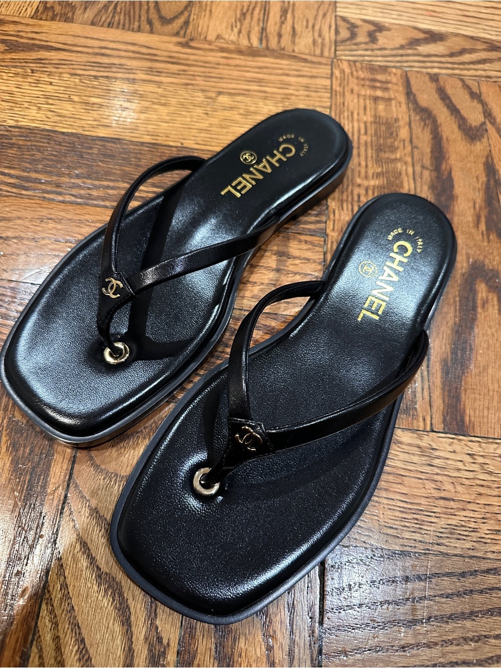 CHANEL Black Leather Logo Thong Sandals with Gold Accent